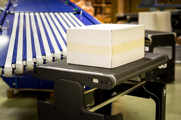 Robots versus conveyors: a showdown in warehouse logistics