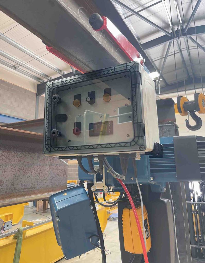Polycarbonate enclosures protect crane control architecture in corrosive atmospheres